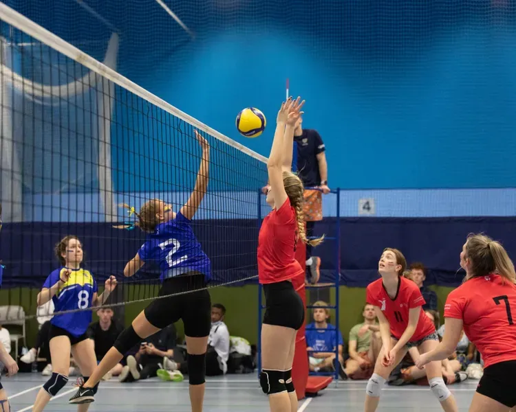 volleyball being played inside