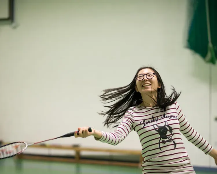 girl playing badminton