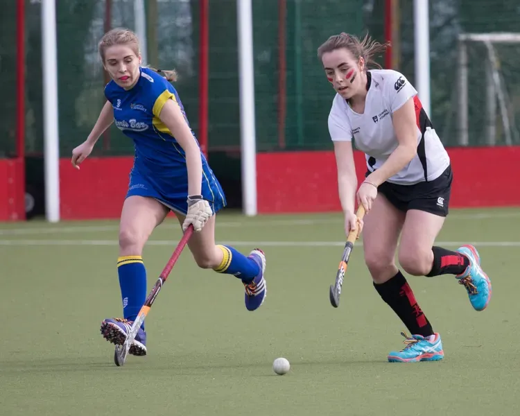 women playing hockey