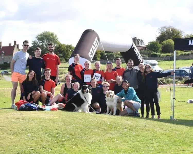 Triathlon team posed for a photo near the finish line