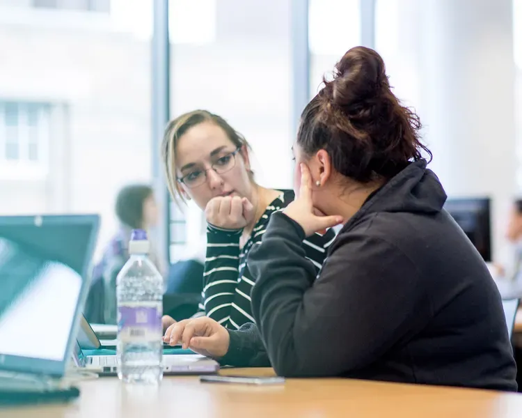 Two students in library