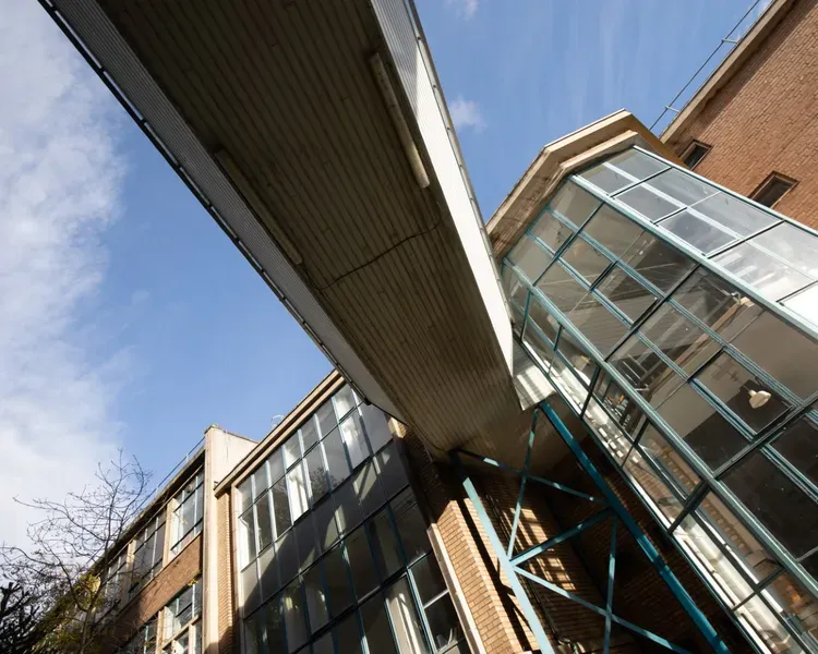 Crawford Building looking up at windows and walkway. 