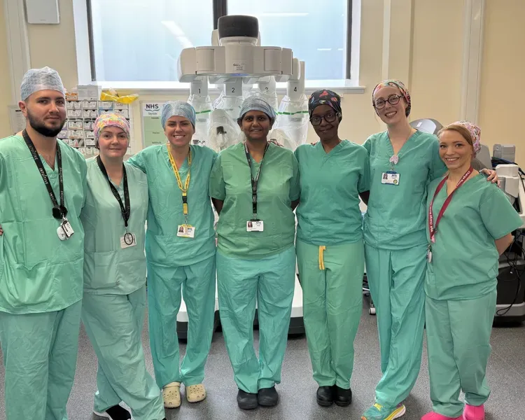 Dr Kalpana Ragupathy with her surgical team in front of the Tay Robot, which is used for pioneering surgery in the hospital