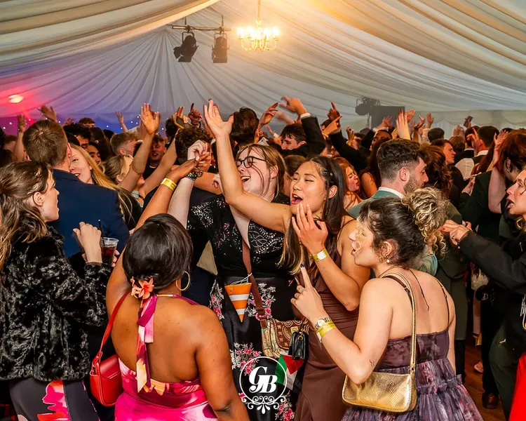 Students celebrating graduation dancing at the Grad Ball at DUSA