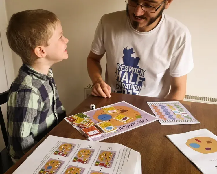 Parent and child play a game to learn more about plant cell biology