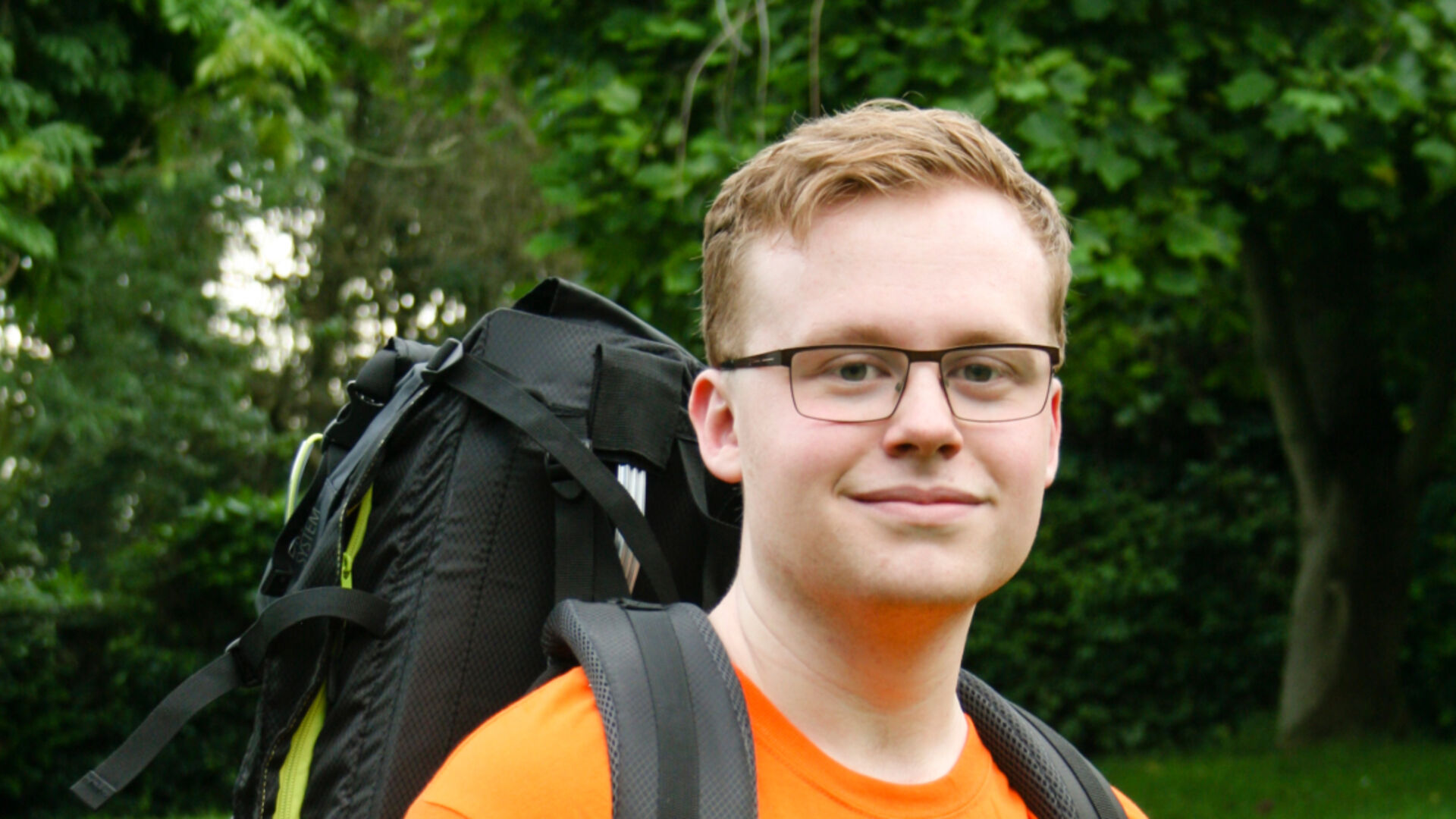 Student Curtis Large wearing a hiking backpack