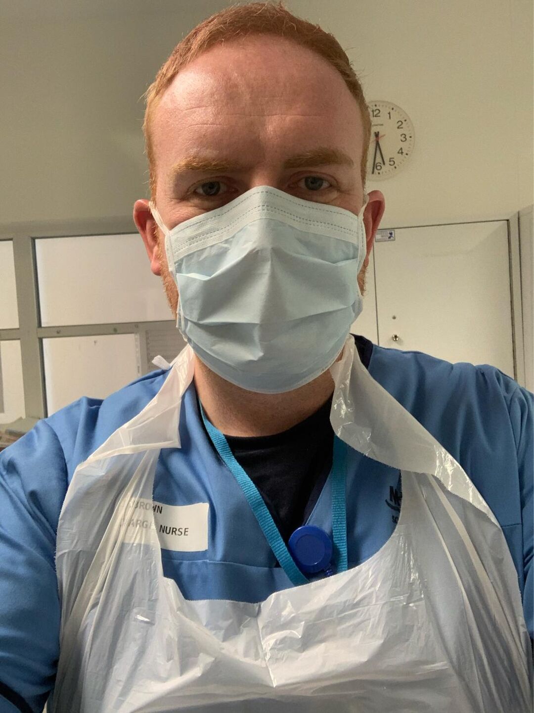 John Brown, Mental Health Nursing graduate, in scrubs