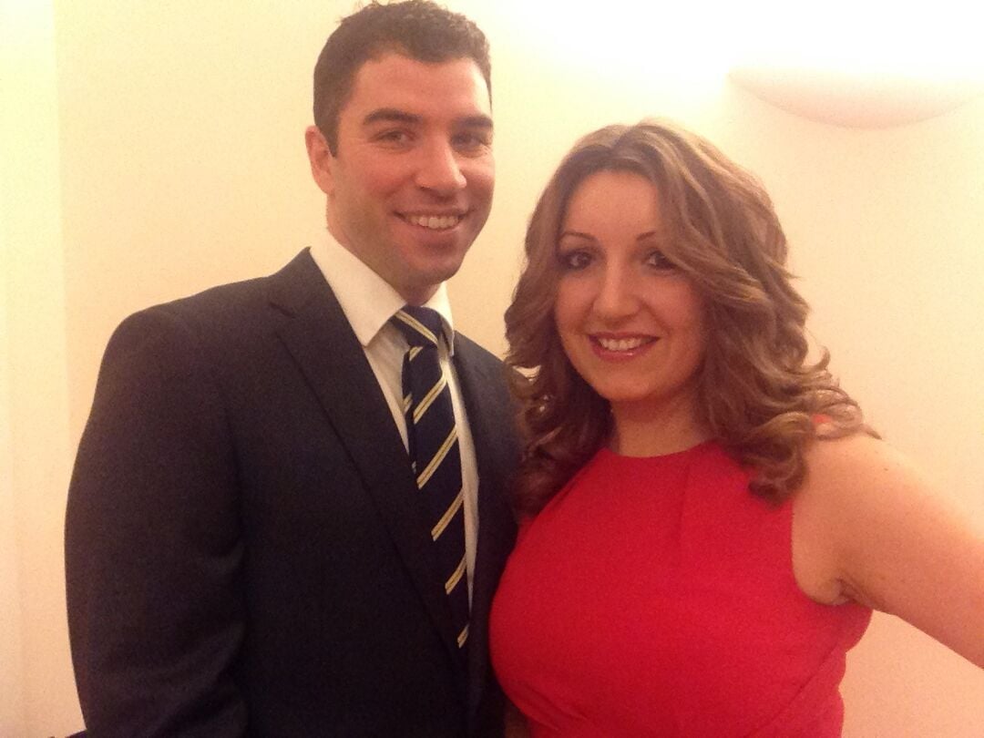 a man in a suit and a woman in a red dress