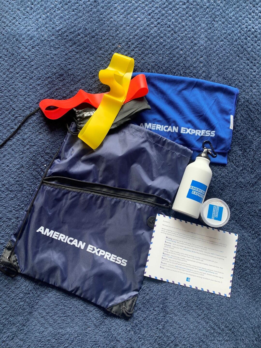 a goody bag from American express including a bag and water bottle