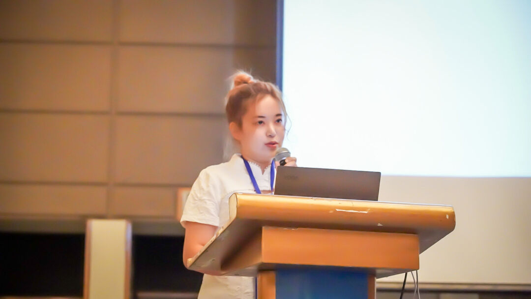 Crystal Tao talking at a lectern 