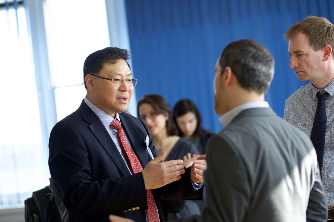Delegates in discussion during a research seminar