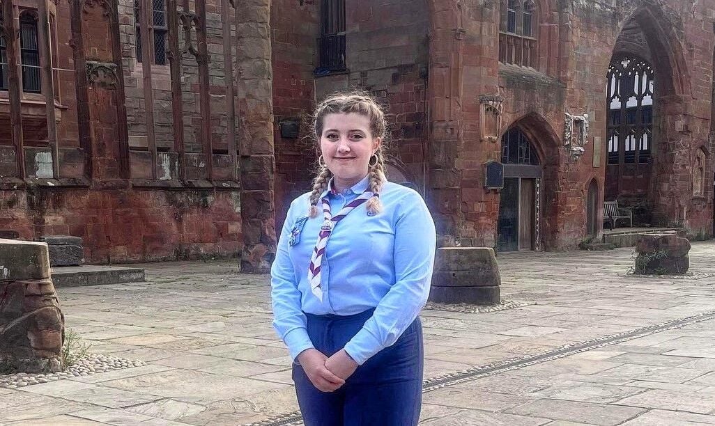 Photograph of Katie Tonks posing in her Girlguiding uniform