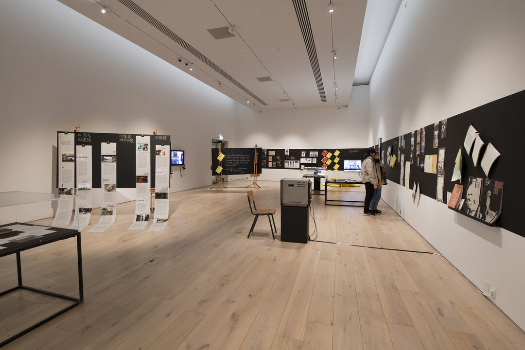 Exhibition Installation view, blackboards with artworks, print and archives round a white gallery