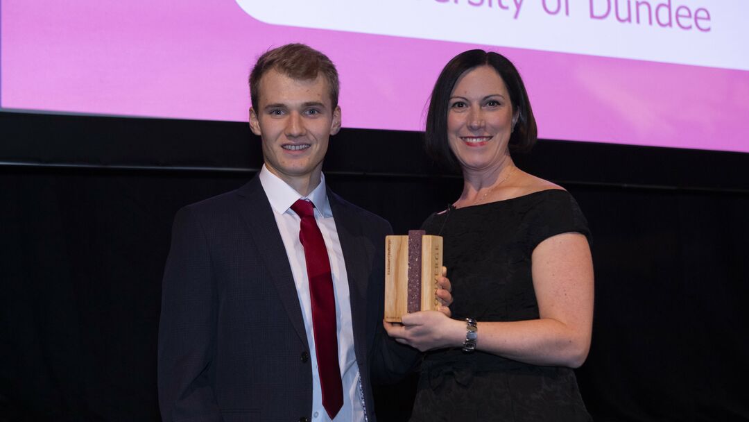 Ryan receiving his award at Converge Awards 2023