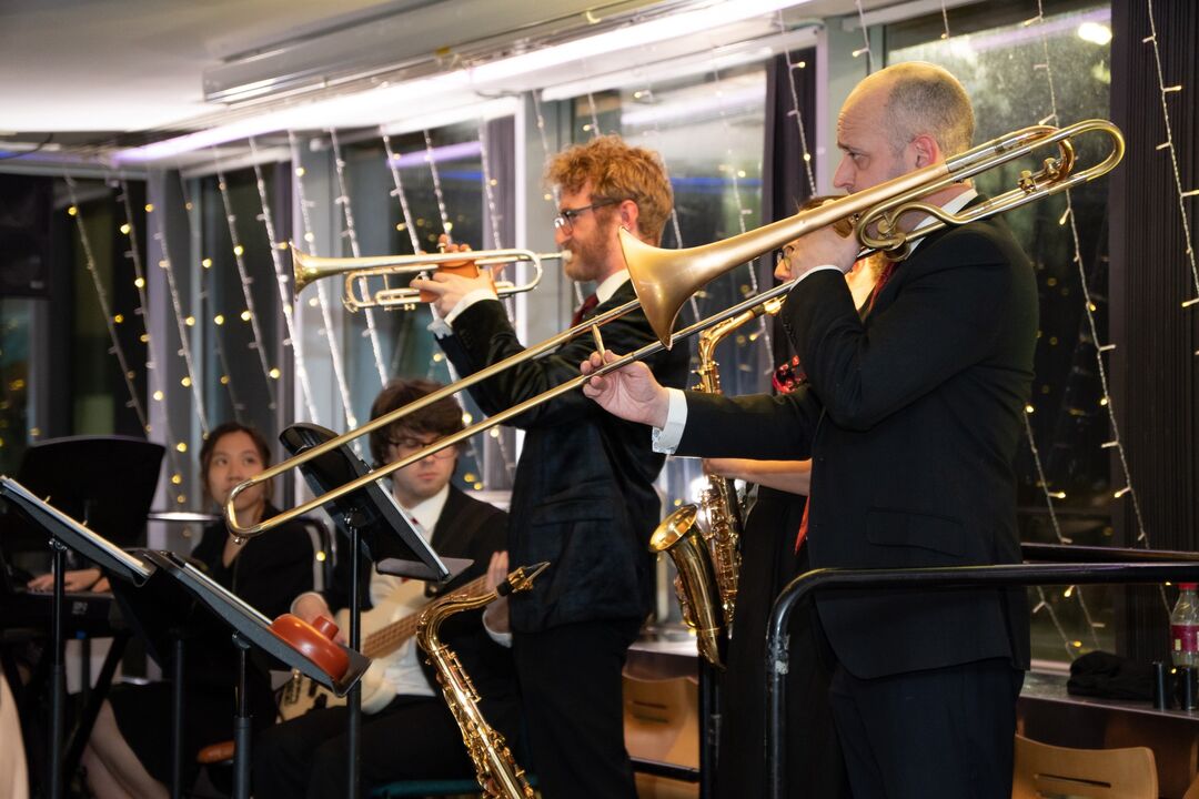 Staff and students playing music together