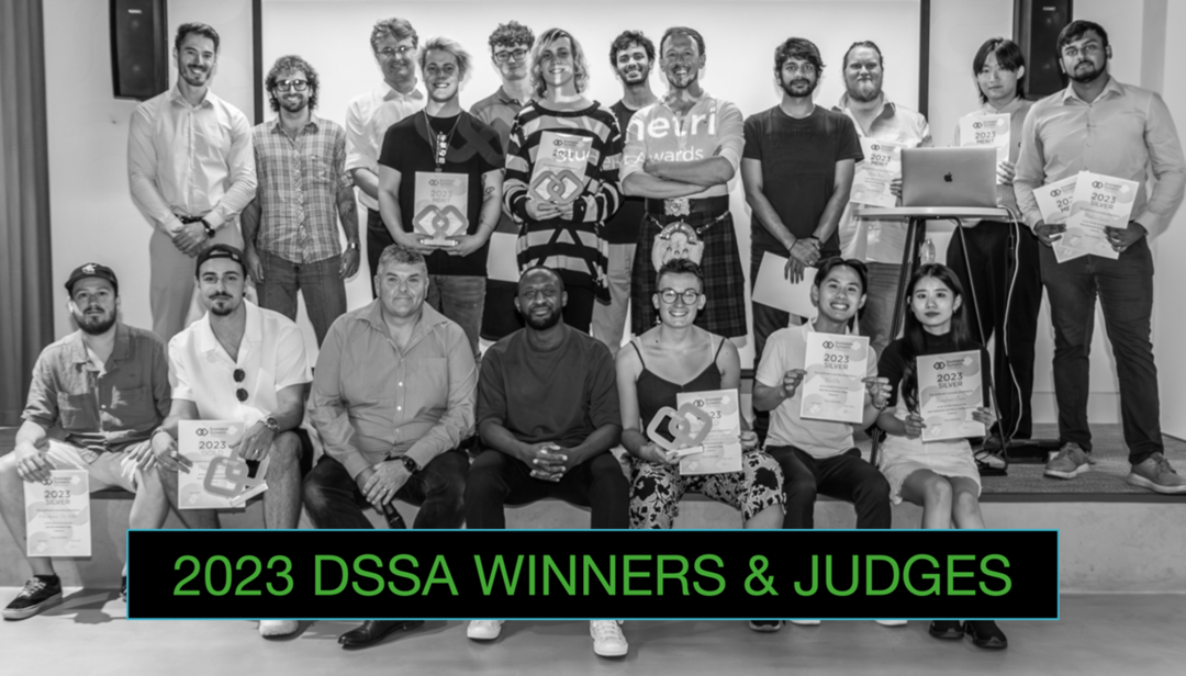 The DSSA winners and judges - some people sitting in the front and a larger group of people standing behind.