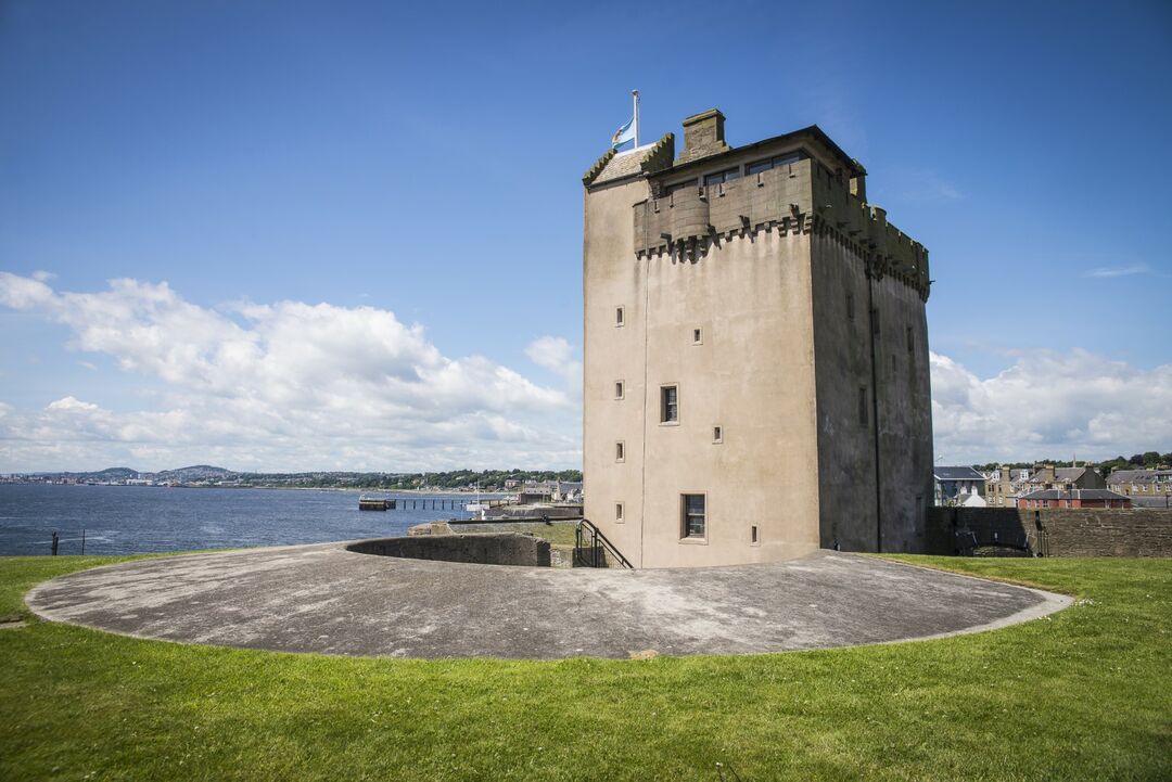 Castle standing in front of sea