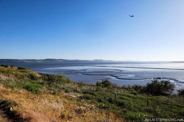 overlooking river, with blue sky