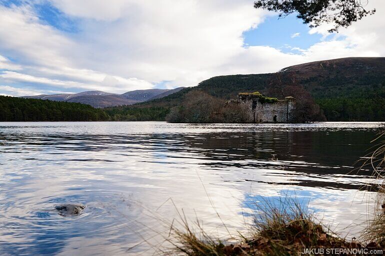 loch surrounded by mountains in the summer