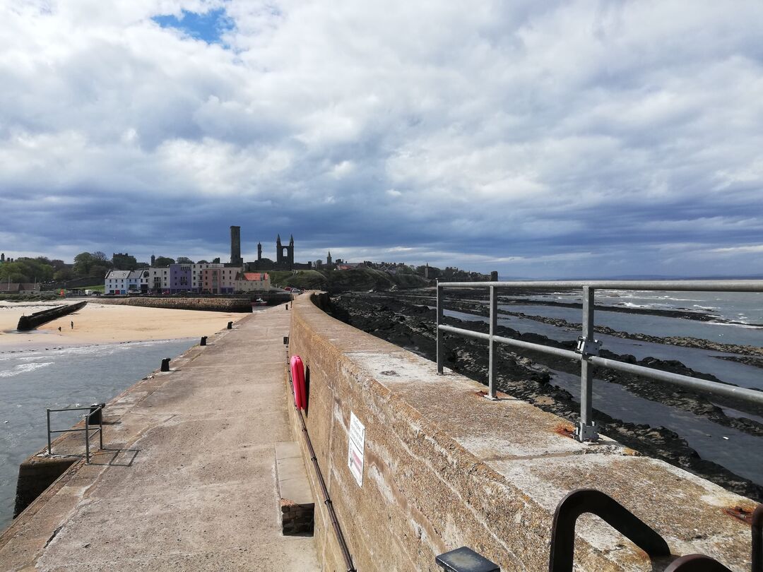 Pier looking towards town of St Andrews with ruined cathedral
