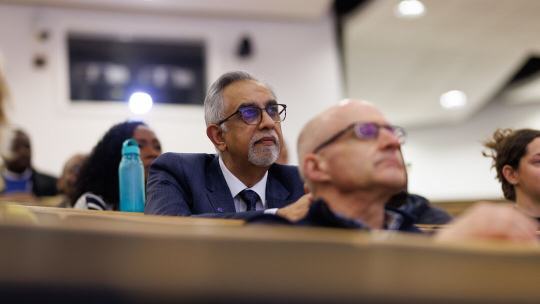 Audience member listening intently at the Africa Lecture Series event