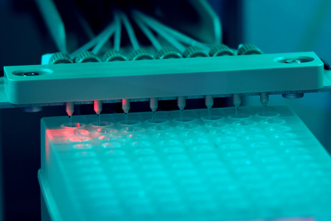 A machine with a red light, indicating power on.