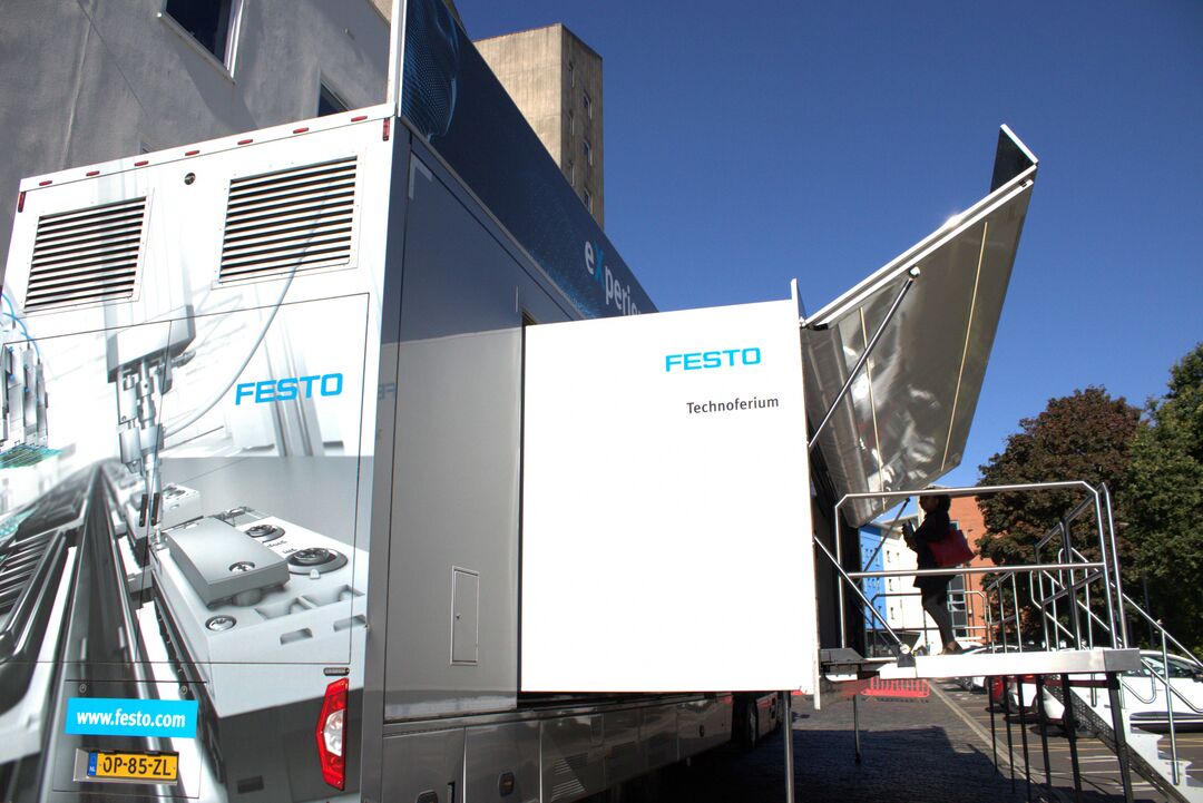 The side of the Technoferium - the trailer/expo space, with the side of the steps leading up to the entrance and an external platform.