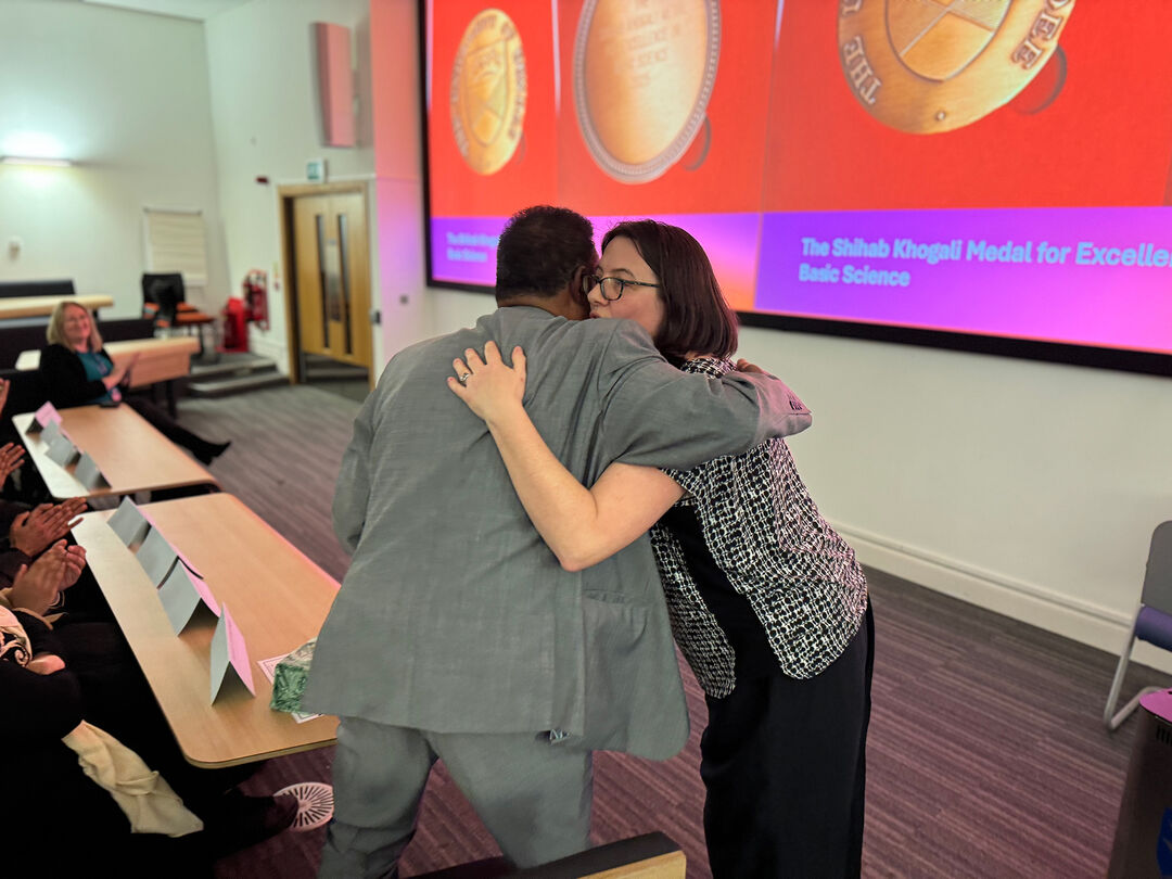 Shihab receives a hug at his farewell