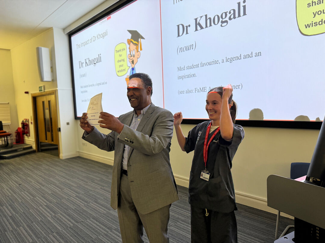 Shihab accepting a certifcate