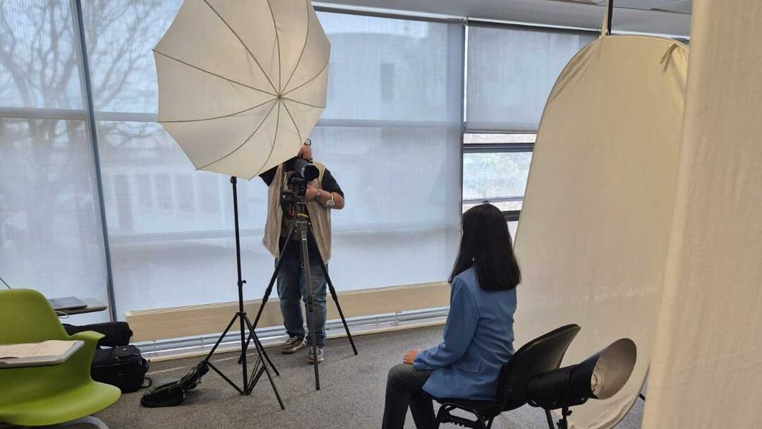 A student getting their photo taken for LinkedIn at the International Student Symposium event