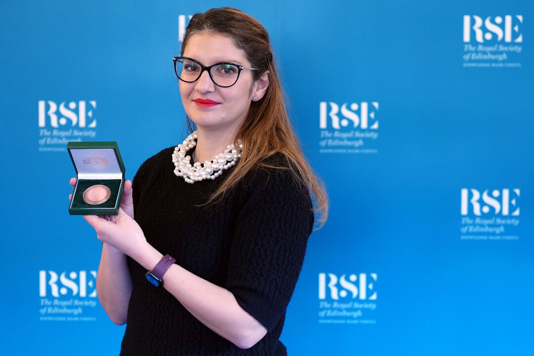 Dr Ralista Madsen, wearing glasses, with her medal