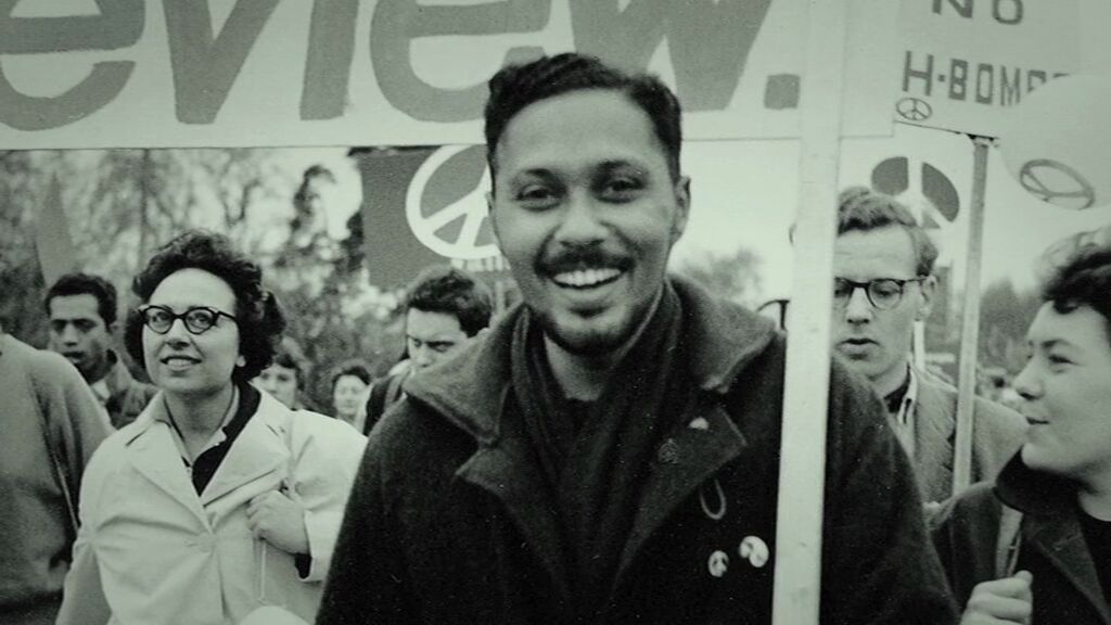 Black and white photograph of Stuart Hall on a CND march
