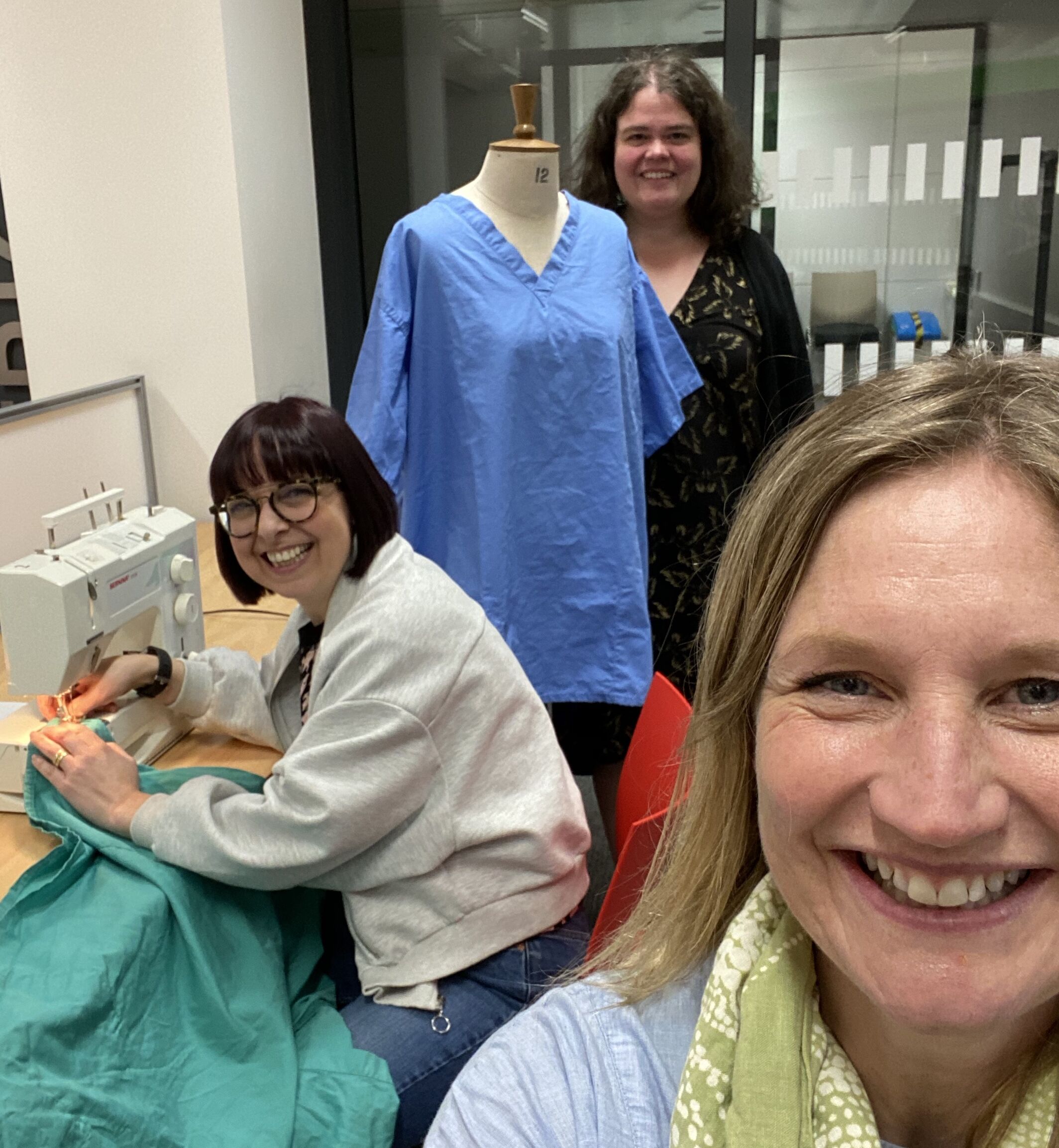 Volunteers in the NHS scrubs hub set up on campus